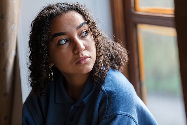 Beautiful mixed race African American girl teenager female young depression