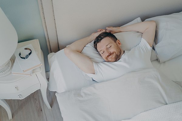 View From Above Of Young Happy Relaxed Caucasian Man With Attrac sleeping man